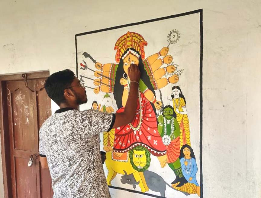 Aru painting on different School walls to educate kids about ancient Indian art forms